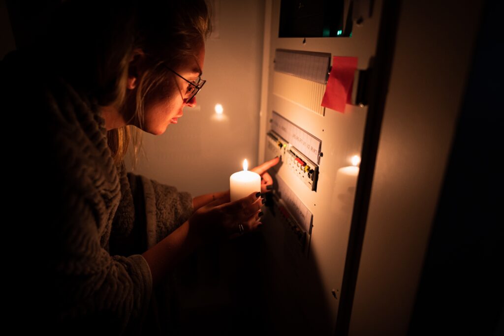 A,Girl,Is,Checking,An,Electrical,Shield,After,An,Electrical