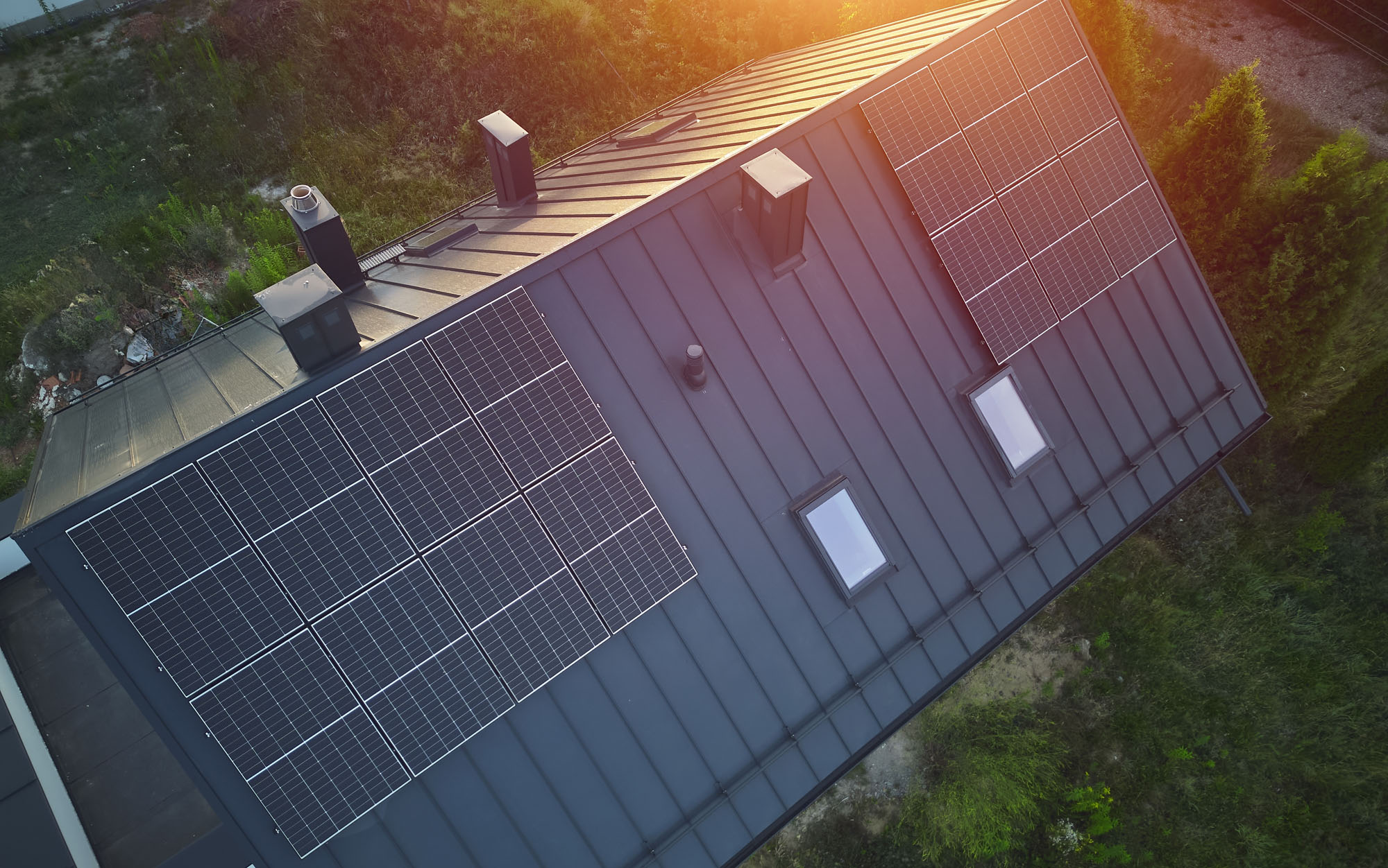 Overhead,Shot,Of,House,Roof,With,Installed,Solar,Panels house roof with solar panels aerial shot