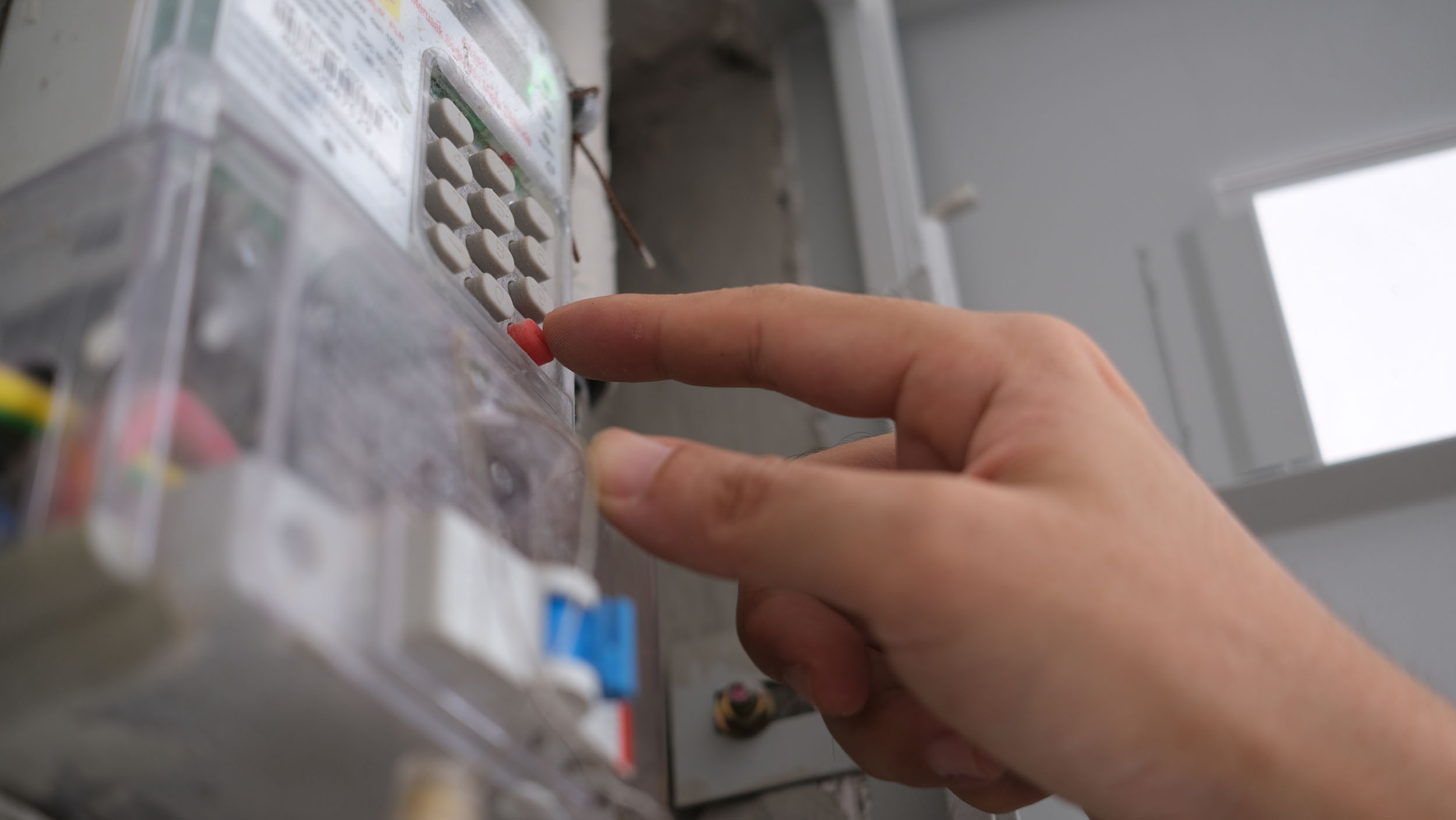The,Hand,Is,Entering,The,Pin,For,Prepaid,Electricity prepaid electricity meter