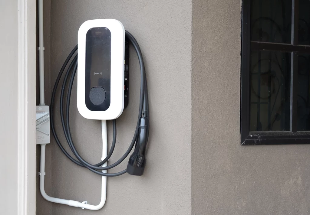 7kW electric car charger attached to the outside wall of a house